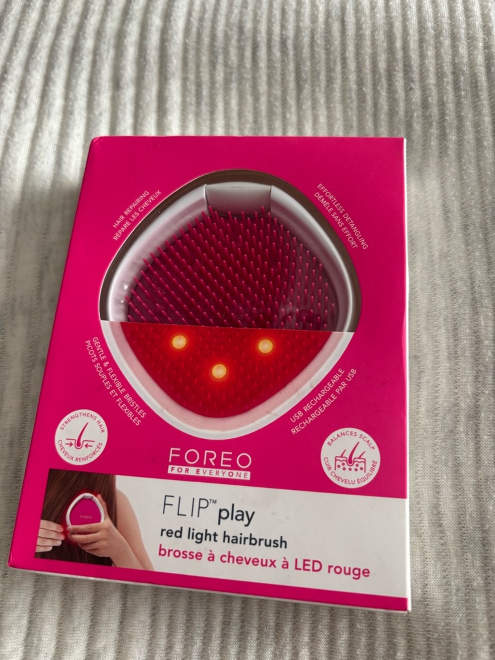 FOREO Flip Play Hairbrush in Hot Pink with Red LED